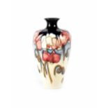 A Moorcroft 'Wild Cyclamen' pattern vase by Emma Bossons of tapered form, signed by artist in gold,