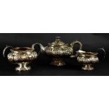 A George IV hallmarked silver gilt three-piece tea service comprising teapot, height 17.