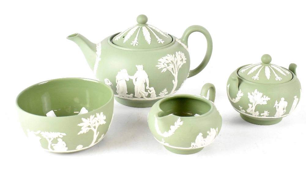 A Wedgwood sage green four-piece tea set to include teapot, lidded sucrier, milk jug and slop bowl,