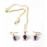 A diamond and amethyst cluster necklace and earring set,