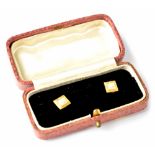 A pair of 18ct gold collar studs with small cultured pearl on square face, in presentation box,