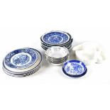 A quantity of blue and white wares including Willow pattern plates,