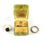 Three yellow metal rings comprising a signet ring with engraved stag's head,