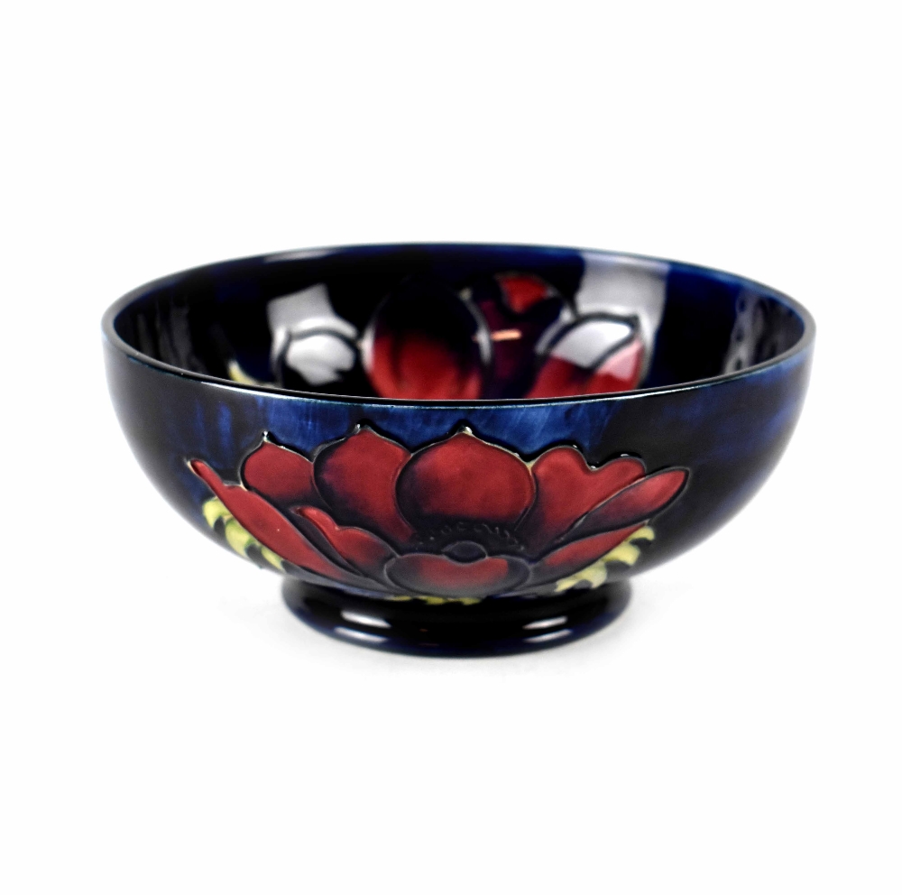 A Moorcroft small bowl, cobalt blue ground in anemone pattern, green marks to base, diameter 16cm.