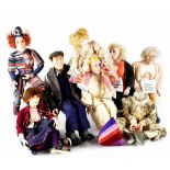 Julia Hills; a collection of seven handmade collectors' dolls, each of different posing,