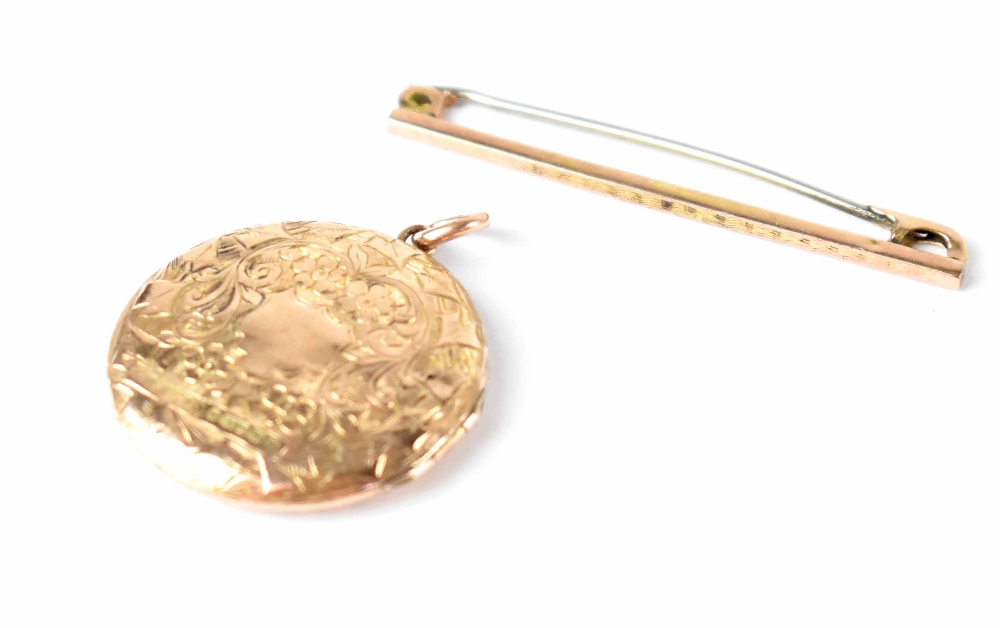 A 9ct gold bar brooch and a 9ct gold hallmarked circular locket with shield and floral scroll