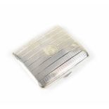 A George V hallmarked silver cigarette case of cushioned rectangular form,