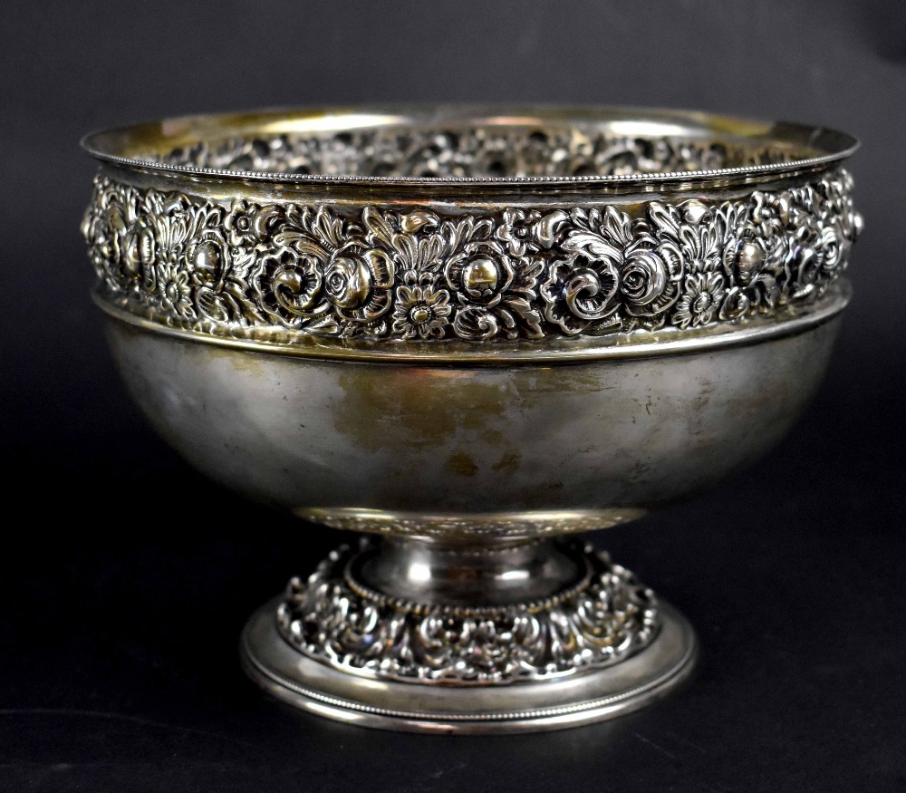 An Edward VII hallmarked silver footed rose bowl with repoussé rose and foliate decoration,