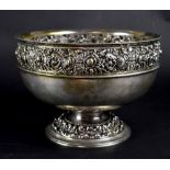 An Edward VII hallmarked silver footed rose bowl with repoussé rose and foliate decoration,