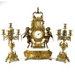 An Imperial gilt metal clock garniture,