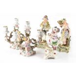 A pair of 19th century Continental porcelain three-branch candelabra,