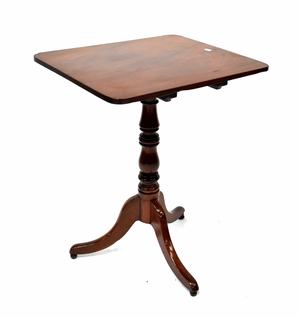 A Georgian mahogany rectangular tilt-top occasional table on turned column and tripod outswept base