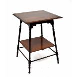 An Edwardian mahogany square-topped occasional table on ring turned legs with undershelf and