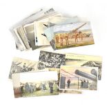 Approximately sixty mostly WWI-related postcards depicting the Army, Navy and Air Force,