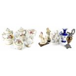 A Capodimonte porcelain six-place tea set with embossed putti decoration on gilt and black ground,