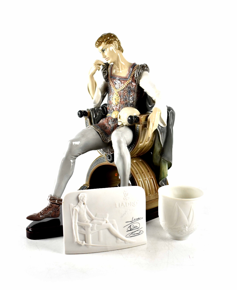 A Large Lladro seated 'Hamlet' with skull on knee on shaped wooden base,