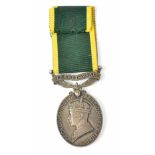 A George V Territorial Efficiency Medal named to 2576052 Sigmn. T.D. Moore. R. Sigs.