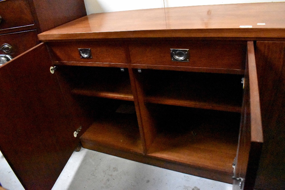 A mid-20th century rosewood sideboard comprising two pairs of cupboard doors, - Image 2 of 4