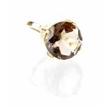 A 9ct gold fashion ring, the four-claw set facet cut smoky quartz in a hallmarked 9ct gold mount,