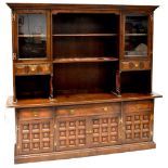 A Georgian style dark stained mahogany dresser with enclosed plate rack with pair of glazed