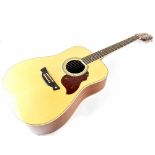 A Crafter six-string 'Dreadnought' natural acoustic guitar with a spruce top and mahogany back and
