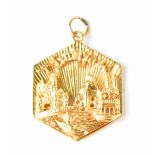 A Disneyland 14ct gold octagonal fob/ keyring, the front depicting the Disneyland castle,