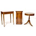 A reproduction mahogany drum table with leather insert top, on tripod base,