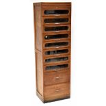 An oak haberdashery cabinet by 'D Matthews & Son Ltd, The Liverpool Shop Fitters',