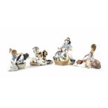 Four Lladró figures of boys and girls with dogs (4).