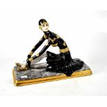 A Porcellanaester Bessano porcelain figure of an Art Deco lady dressed in a black and gilt outfit