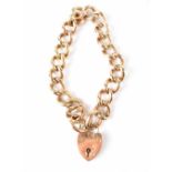 A rose gold curb link bracelet, alternate links with engraved decoration, indistinctly marked,