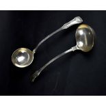A pair of George IV hallmarked silver ladles with shell finials,