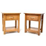 A pair of modern oak bedside/occasional side tables, each with single drawer and lower shelf,