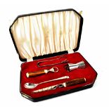 A Viners 1970s horn-handled cased bar set to include cheese knife, bottle opener,