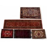 A Keshan wool hall runner, red ground with multi-medallions, 273 x 69cm,