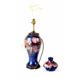 A large Moorcroft table lamp in the 'Anemone' pattern on blue ground, height to shoulder 35cm,