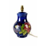 A Moorcroft table lamp of baluster form, cobalt blue ground with clematis pattern,