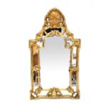A Baroque-style gilt-framed mirror,