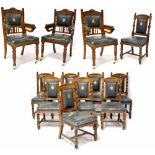 A set of ten Victorian oak dining chairs with carved top rails,