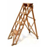 A vintage wooden folding stepladder with four treads, height 118cm.