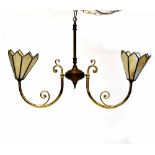 A brass and gilt metal twin-branch light fitting with scroll arms and octagonal cream leaded glass