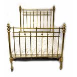 An Edwardian-style decorative brass double bed frame, brass finials to top and base, width 138cm,