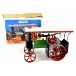 A boxed Mamod steam tractor with vaporizing spirit lamp funnel,