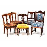 Five various Edwardian dining chairs comprising a pair of splat-back chairs with floral motifs,