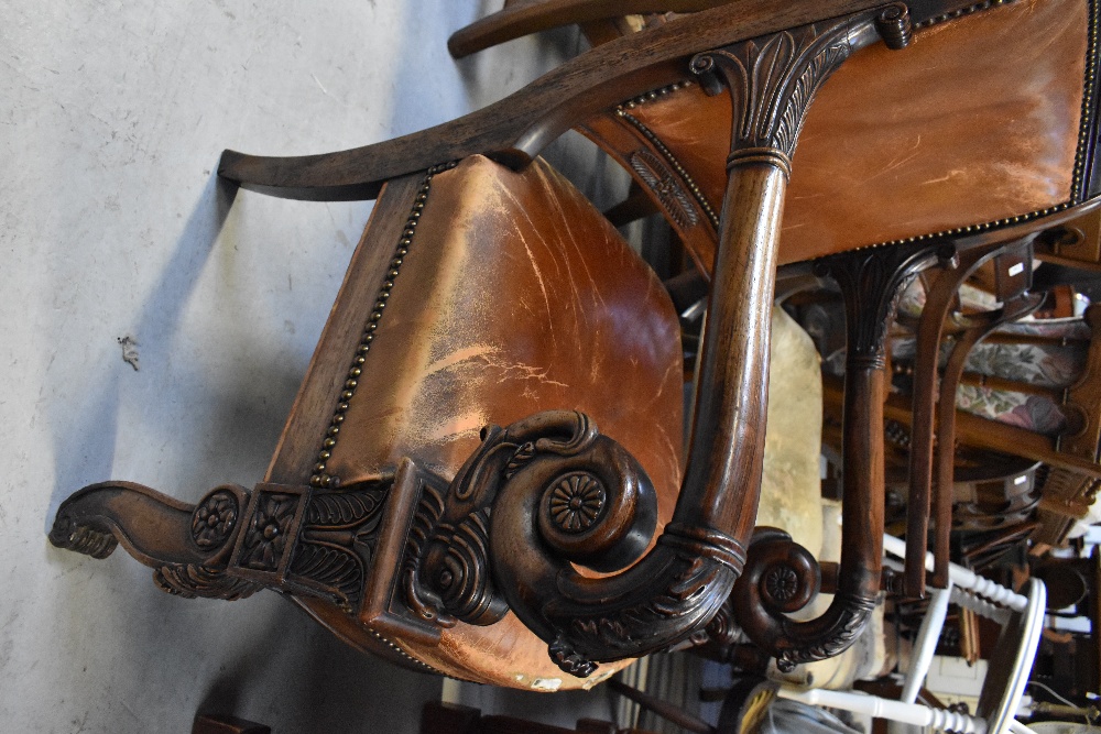 A 19th century rosewood open arm library chair with foliate and Athenian carved top rail, - Image 4 of 7