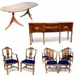 A reproduction mahogany and inlaid dining suite comprising an oval extending table,