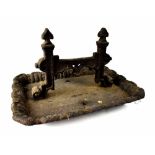 A 19th century cast iron boot scraper on tray base, length 40cm.