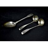 A Georgian hallmarked silver dessert spoon and two non-matching Georgian small ladles,