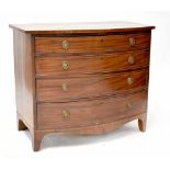 An early 19th century mahogany bow-fronted chest of four long graduating drawers,