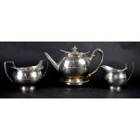 A George III hallmarked silver three-piece tea service with engraved Greek Key design and a